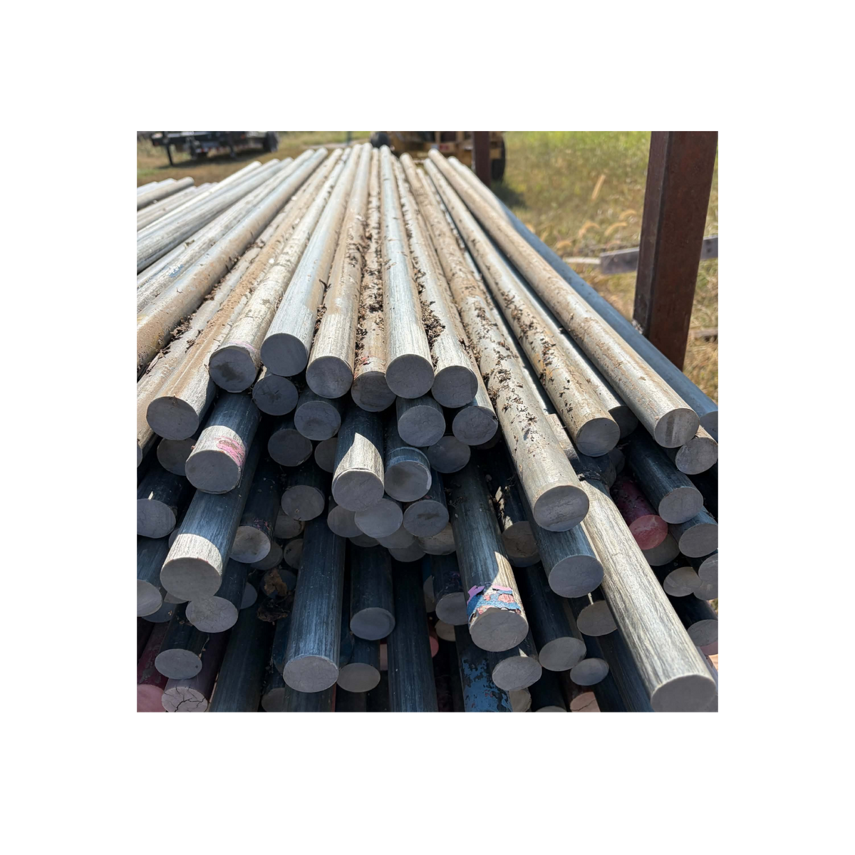 USA Grazing Systems 1.25 inch uncoated fiberglass rod posts stacked for permanent electric livestock fencing