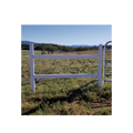 USA Grazing Systems Timeless Super H Brace installed on a permanent fence line with a metal gate in a rural pasture.