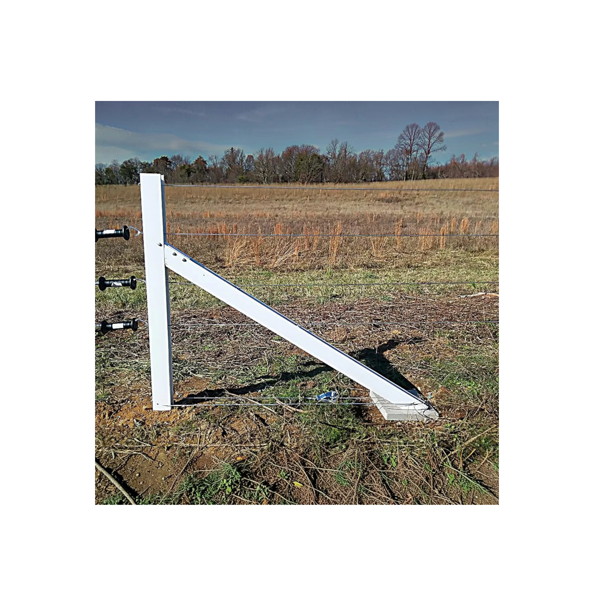 USA Grazing Systems Timeless rigid PVC floating brace installed on a high-tensile electric fence in a pasture