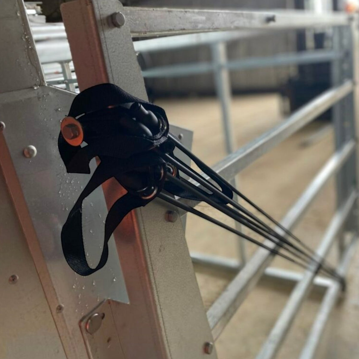 USA Grazing Systems Advantage Creep Gate Assist Kit featuring black heavy-duty lift bands attached to a metal gate.