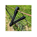 USA Grazing Systems LOCKJAWZ 5-inch black plastic extended electric fence insulator attached to wire fencing